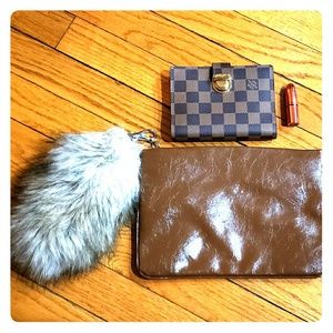 Clutch bag with fur attachment